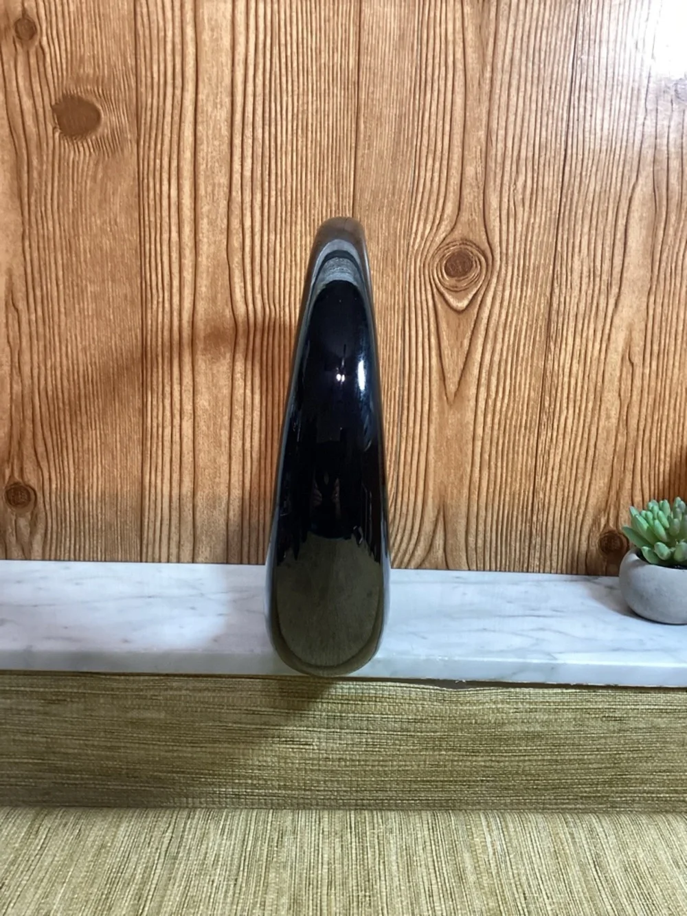 Dolbi Cashier sculptural circular